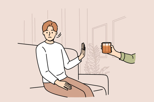 意志坚定的男子拒绝喝酒，做出停止的手势，坐在沙发上，手里拿着威士忌图片下载