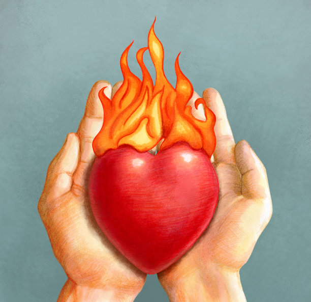 捧起的双手捧着一颗燃烧的心图片下载