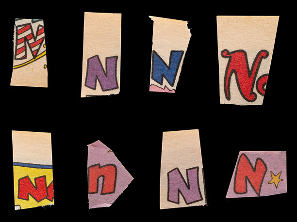 赎金字体类型N从打印输出杂志切割，拼贴元素的平面设计，jpg隔离在黑色背景图片下载