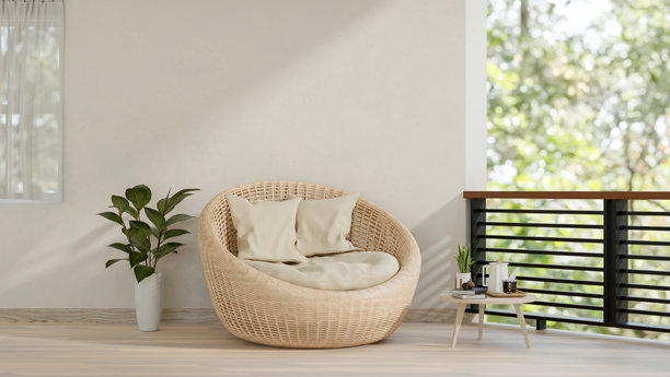 当代家庭阳台休闲空间的特色是带枕头的柳条躺椅。图片下载