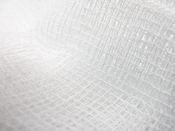 特写白色医用绷带的细节和纹理编织图案背景，微距照片细节的绷带编织纤维，壁纸图片下载