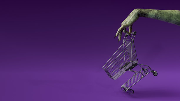 僵尸手拿着空的购物车。万圣节的概念图片下载