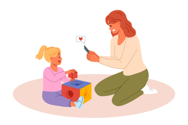 开心的妈妈用手机拍下了女儿玩积木的照片图片下载