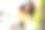 照片的年轻积极的女孩波浪发型学生写笔记在练习册上穿着黄色时尚夹克花时间在户外的春天图片下载