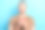 照片开朗轻松英俊的男人尾巴发型穿着米色t恤拿着杯子享受早晨的时间孤立的蓝色背景图片下载