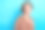 照片中甜美梦幻的女士穿着印花衬衫微笑着回头看空旷孤立的蓝色背景图片下载