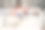 可爱漂亮的女士穿着橙色衬衫坐在沙发上玩小猫在室内房间的照片图片下载