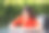 照片漂亮的青少年好心情的女孩坐在桌子咖啡馆写笔记本穿着红色的衣服走在城市城市公园外图片下载