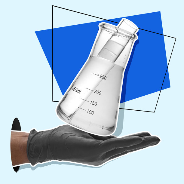 一个人拿着一个盛有液体的烧杯图片下载