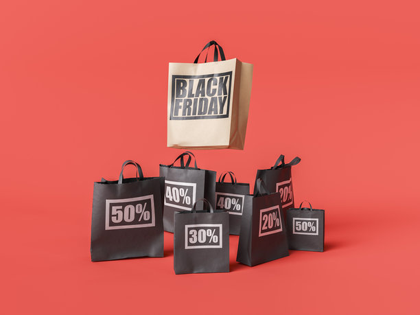 黑色星期五购物袋显示大折扣的红色背景图片下载