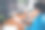 年轻女子的照片打字键盘持有设备白色屏幕穿蓝色衬衫现代办公室程序员阁楼房间室内室内工作空间图片下载