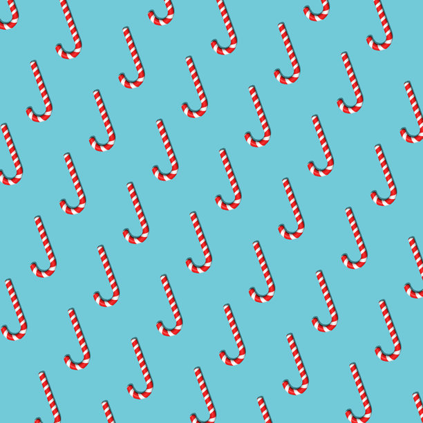 红色条纹糖果的无缝图案。硬糖、拐杖糖、棒棒糖。适用于面料、包装纸、纺织品、印刷、壁纸的背景。圣诞节和新年背景。图片下载