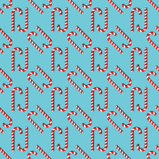 红色条纹糖果的无缝图案。硬糖、拐杖糖、棒棒糖。适用于面料、包装纸、纺织品、印刷品、墙纸的背景。圣诞节和新年背景。图片下载