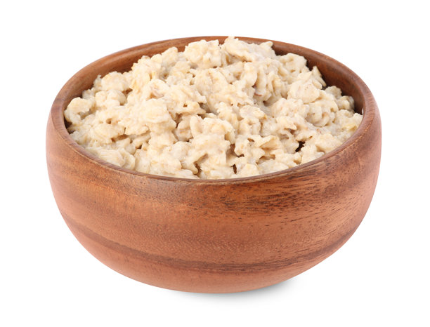 美味的煮燕麦粥盛在碗中，背景为白色。图片下载