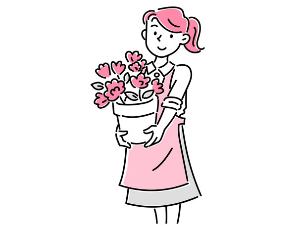 一位年轻女性员工在花店里手持一个装有花的花盆图片下载