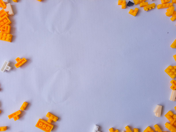 五彩缤纷的黄色塑料玩具砖背景图片下载