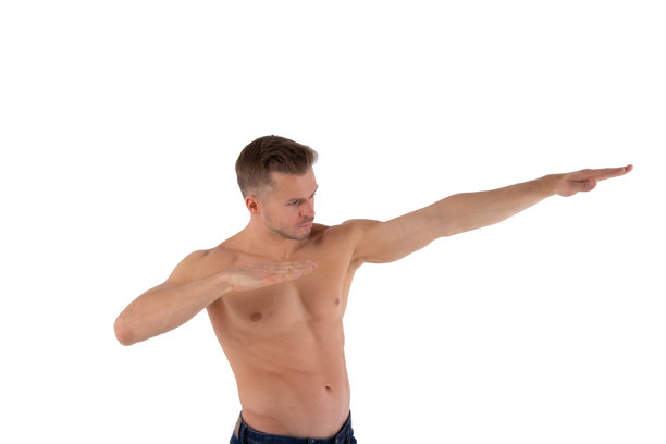 运动与健康的生活方式：一位有魅力的男人在做普拉提，白色背景图片下载