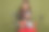 一位穿着棕色服装的光鲜迷人的年轻女士，骑着滑板车，使用现代电子设备，背景为卡其色。图片下载