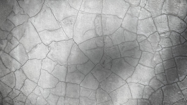 建筑物内开裂的水泥地面照片，图片边缘较暗图片下载