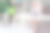全身照片，年长女性合格医生在办公室室内穿着白大褂，使用手机和笔记本电脑。图片下载