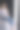 孕妇坐在白色立方体上，把手放在肚子上。牛仔风格，白衬衫和牛仔裤。金发女士赤脚图片下载