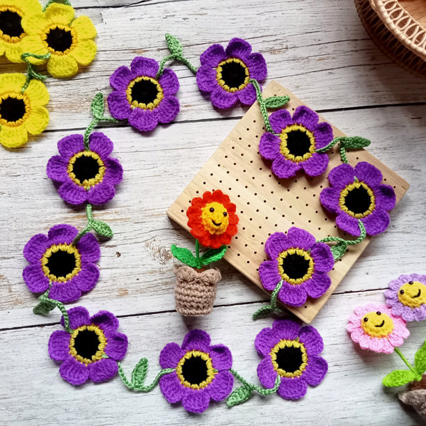 钩针花项链，雏菊花，向日葵，手工编织，钩针作品，色彩缤纷的花朵用于图片、背景、插图、纹理图片下载