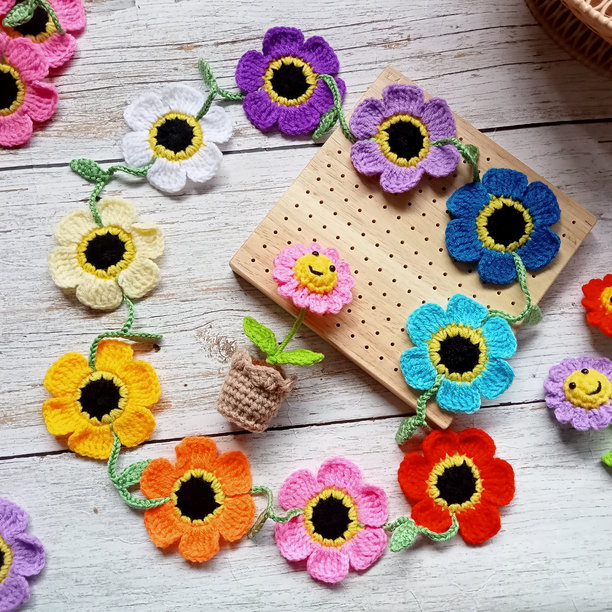 钩针花项链，雏菊花，向日葵，手工编织，钩针作品，色彩缤纷的花朵用于图片、背景、插图、纹理图片下载