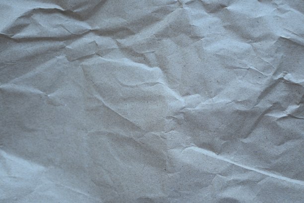 灰色皱纹纸质感作为背景，旧牛皮纸作为背景，皱纹包装材料质感作为背景照片。图片下载