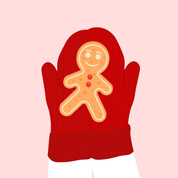 红色雪地手套的手里拿着姜饼图片下载