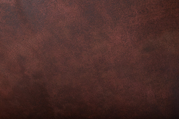 红棕色墙壁，带有留白的库存照片。背景，抽象纹理。空旷的旧墙，竖版照片。新年贺卡的背景。留白。图片下载