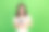 特写照片：年轻迷人、可爱的女士穿着粉色上衣，手持新智能手机，梦幻般地凝视着空旷的空间，适合广告促销，背景为绿色。图片下载