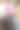 这张图片展示了一位女性的双脚平衡在一个灰色的健身球上，背景是一个舒适的家居环境。重点在于她的粉色和白色运动鞋，为她的健身活动增添了一丝俏皮的气息。图片下载