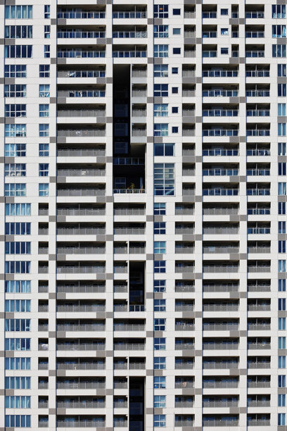 现代设计塔楼公寓建筑墙壁的特写照片，适合用作背景素材图片下载