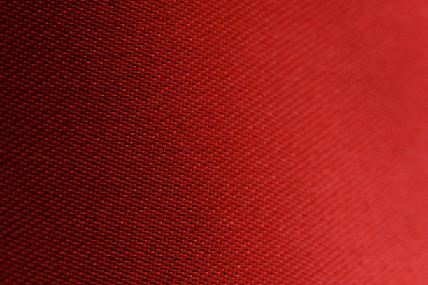 红色纺织品的纹理和背景特写宏观照片。图片下载