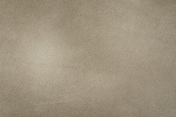 米色绒面革作为背景。绒面皮革特写照片，米色光影。图片下载