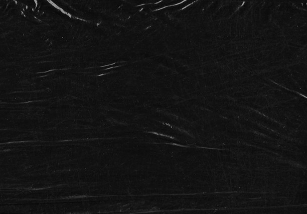 黑色透明塑料薄膜纹理叠加背景。用于海报设计和照片叠加效果的逼真塑料。皱纹纸表面图案，适用于图形设计素材和元素模型。图片下载