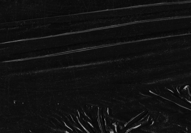 黑色透明塑料薄膜纹理叠加背景。用于海报设计和照片叠加效果的真实塑料。皱纹纸表面图案，适用于图形设计素材和元素模型。图片下载