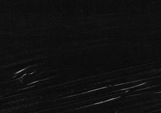 黑色透明塑料薄膜纹理叠加背景。用于海报设计和照片叠加效果的真实塑料。皱纹纸表面图案，适用于图形设计素材和元素模型。图片下载