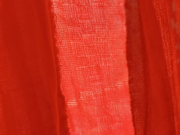 红色编织面料纹理特写照片。红色面料的背景纹理。图片下载