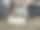 这张照片捕捉了各种建筑材料在户外排列的场景。构图中央是两座迷你装饰房屋，采用石砌和瓦屋顶。图片下载