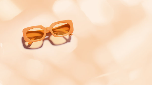 时尚的橙色框太阳镜，背景为桃色，阳光投下的阴影，夏季时尚塑料框眼镜。美学俯视眼镜照片，时尚眼镜产品，简约风格。图片下载
