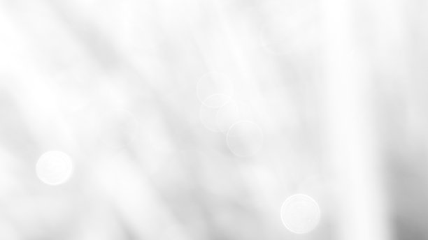 抽象的白色背景，带有柔和的圆形散景效果，营造出微妙而空灵的感觉。适合网站横幅背景的真实散景照片，色彩鲜艳。图片下载
