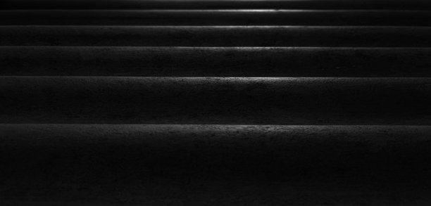 粗糙的黑色灰泥表面的特写。高品质的细节背景照片，具有经典、优雅和奢华的概念。图片下载