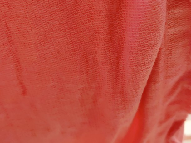 红色编织面料纹理特写照片。红色编织面料的背景纹理。图片下载