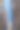 一幅风景如画的历史钟楼照片，周围环绕着乡村建筑和蔚蓝的天空。图片下载
