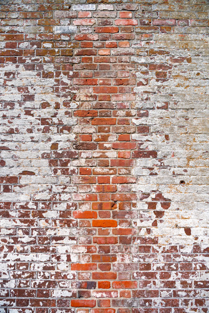 旧的复古破旧砖墙，涂有石灰漆。设计师的背景素材。图片下载