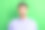 穿着紫色服装、眼睛睁大、嘴巴张开的兴奋年轻男子的照片，背景为绿色。图片下载