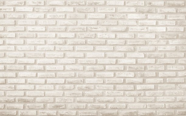 现代奶油砖墙背景照片细节。棕色砖墙纹理背景，适用于涂成黄色的石材瓷砖块，现代室内外背景设计。图片下载