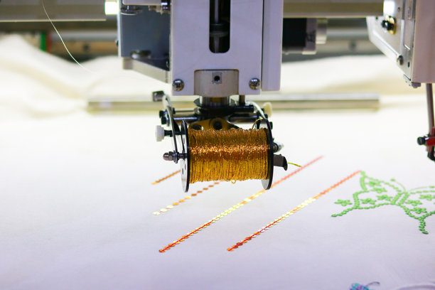 刺绣机上的线轴，特写照片图片下载