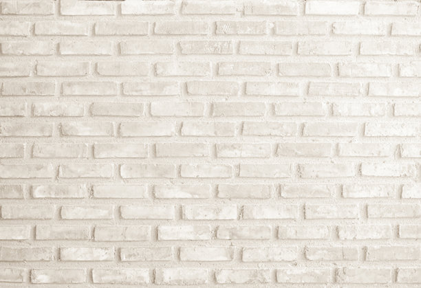 现代奶油砖墙背景照片细节。棕色砖墙纹理背景，适用于涂成黄色光色的石材瓷砖块，现代室内外背景设计。图片下载